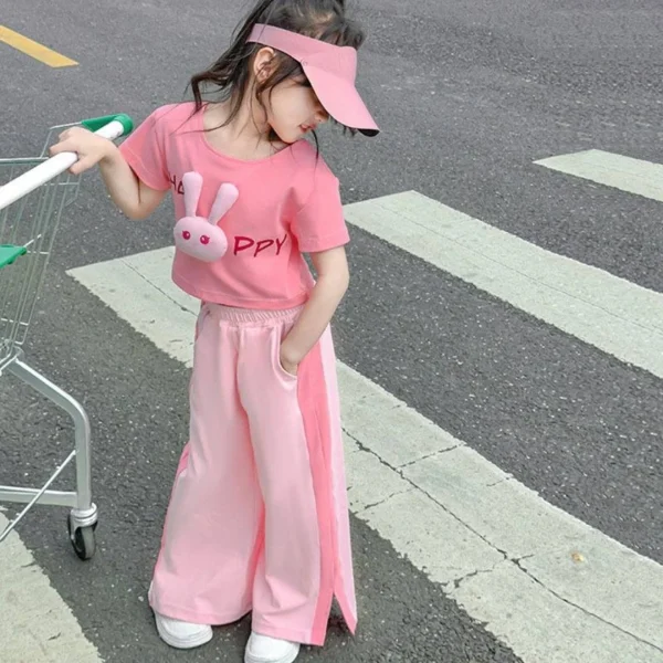 ست کراپ و شلوار دخترانه وارداتی صورتی، مناسب 2 تا 8 سال، جنس 100 درصد پلی‌استر، با عروسک خرگوش برجسته و پاپیون، پرداخت درب منزل، درگاه امن بانکی و ارسال با پست پیشتاز.